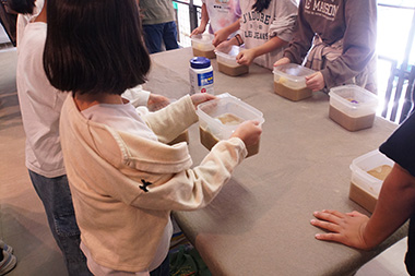 Image: Children conducting a liquefaction experiment