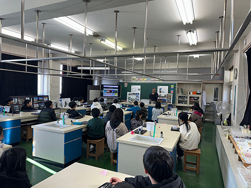 Image: Students listening intently to the lesson