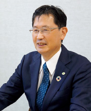 図版:日立製作所理事 田中秘書室長